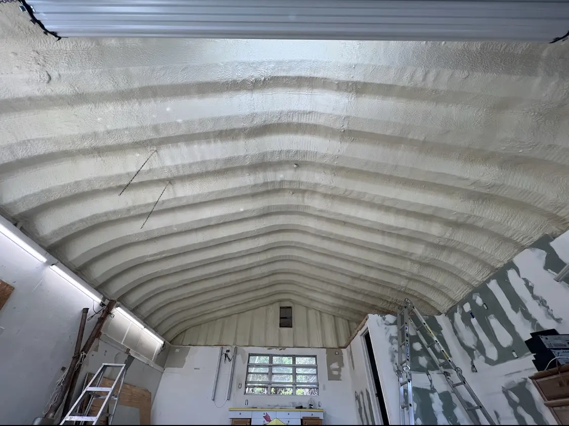 Spray polyurethane foam applied to the underside of a metal roof deck in Santaquin